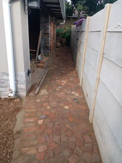 Cobble half brick paving and tar surfacing