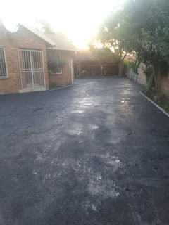 Tar surfacing and tennis courts