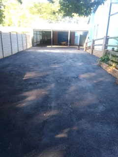 Tar surfacing and brick paving