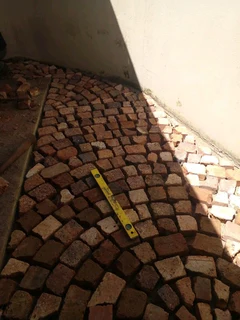 Cobble half brick paving and tar surfacing