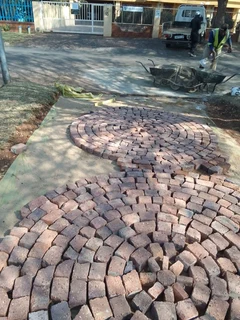 Cobble half brick paving and tar surfacing