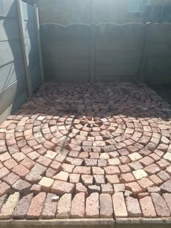 Cobble half brick paving and tar surfacing