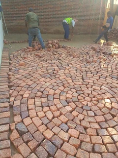 Cobble half brick paving and tar surfacing