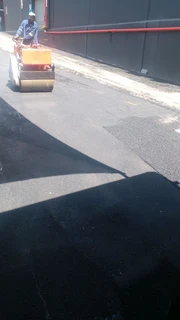 Tar surfacing and tennis courts