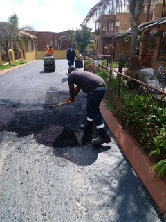 Tar surfacing and tennis courts