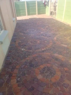 Cobble half brick paving and tar surfacing