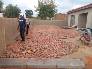 Cobble half brick paving and tar surfacing