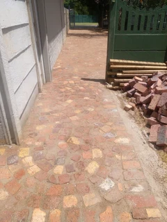 Cobble half brick paving and tar surfacing