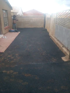 Tar surfacing and brick paving