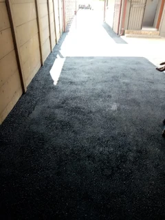 Tar surfacing and brick paving