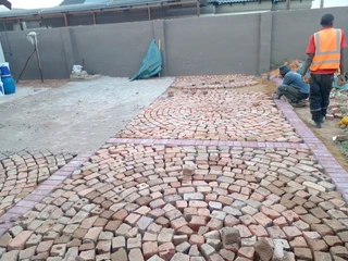 Cobble half brick paving and tar surfacing