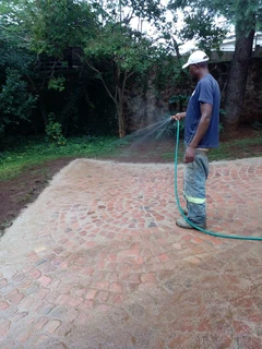 Cobble half brick paving and tar surfacing