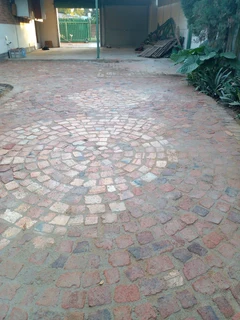 Cobble half brick paving and tar surfacing