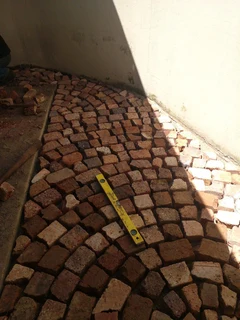 Cobble half brick paving and tar surfacing