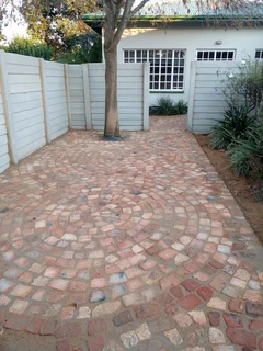 Cobble half brick paving and tar surfacing