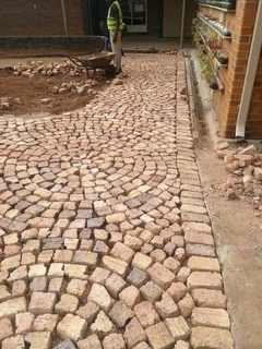 Cobble half brick paving and tar surfacing