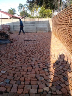Cobble half brick paving and tar surfacing