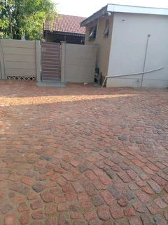Cobble half brick paving and tar surfacing