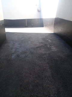 Tar surfacing and brick paving