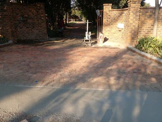 Cobble half brick paving and tar surfacing