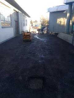 Tar surfacing and tennis courts