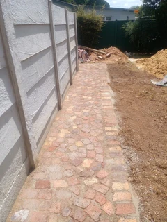 Cobble half brick paving and tar surfacing