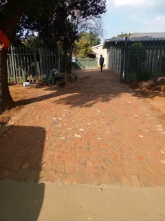 Cobble half brick paving and tar surfacing
