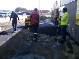 Tar surfacing and brick paving