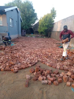 Cobble half brick paving and tar surfacing