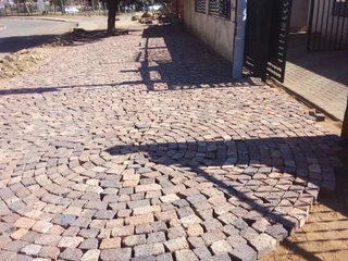 Cobble half brick paving and tar surfacing