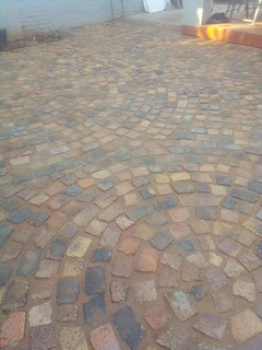 Cobble half brick paving and tar surfacing