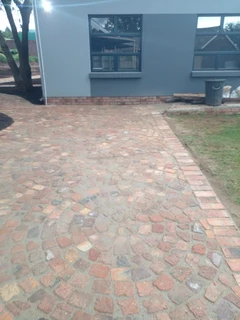 Cobble half brick paving and tar surfacing