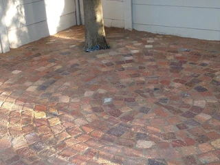 Cobble half brick paving and tar surfacing