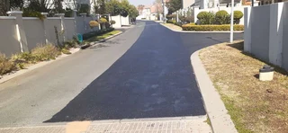 Tar surfacing and tennis courts