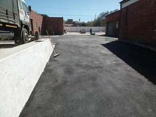 Tar surfacing and tennis courts
