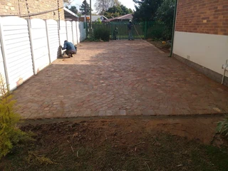 Cobble half brick paving and tar surfacing