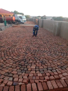 Cobble half brick paving and tar surfacing