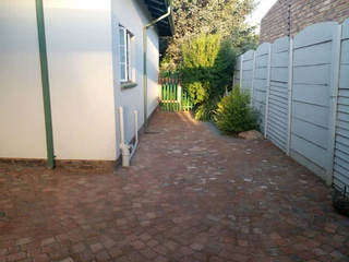 Cobble half brick paving and tar surfacing