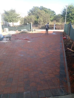 Brick paving and tar surfacing
