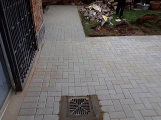 Brick paving and tar surfacing