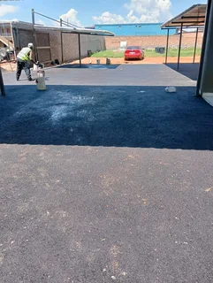 Tar surfacing and brick paving