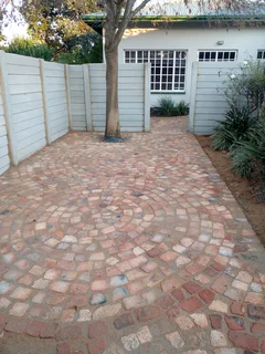 Cobble half brick paving and tar surfacing