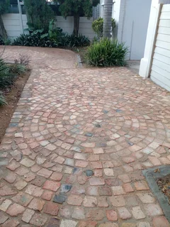 Cobble half brick paving and tar surfacing