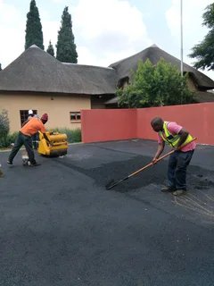 Tar surfacing and tennis courts