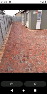 Cobble half brick paving and tar surfacing