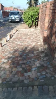 Cobble half brick paving and tar surfacing