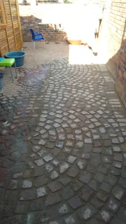 Cobble half brick paving and tar surfacing