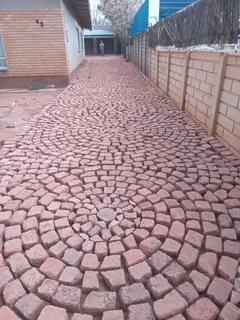 Cobble half brick paving and tar surfacing