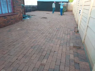 Brick paving and tar surfacing