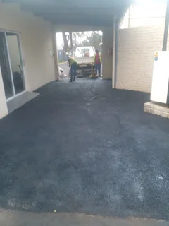 Tar surfacing and brick paving